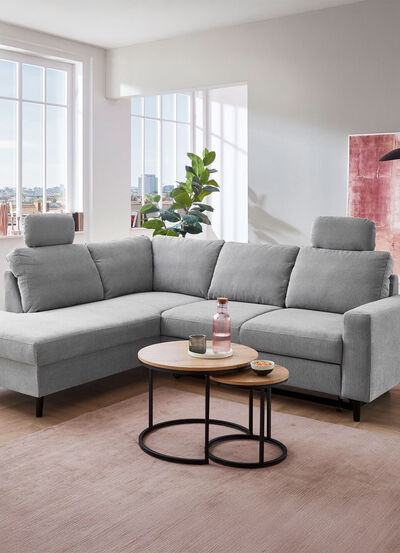 Polsterecke mit Bettfunktion und Ottomane 