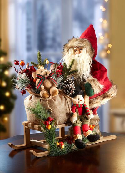 Weihnachtsmann auf Holzschlitten 
