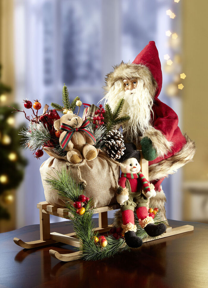 Weihnachtsmann auf Holzschlitten 