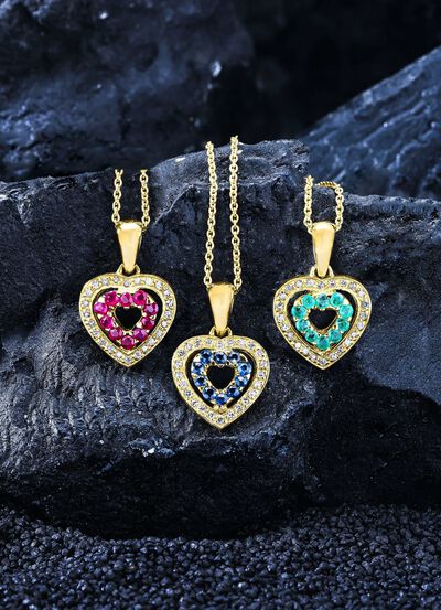 Anh&auml;nger mit synth. Zirkonia und blauen Schmucksteinen 