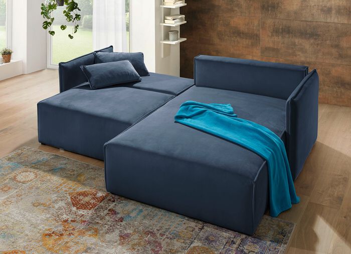 Polsterecke mit Bettfunktion und Hocker 